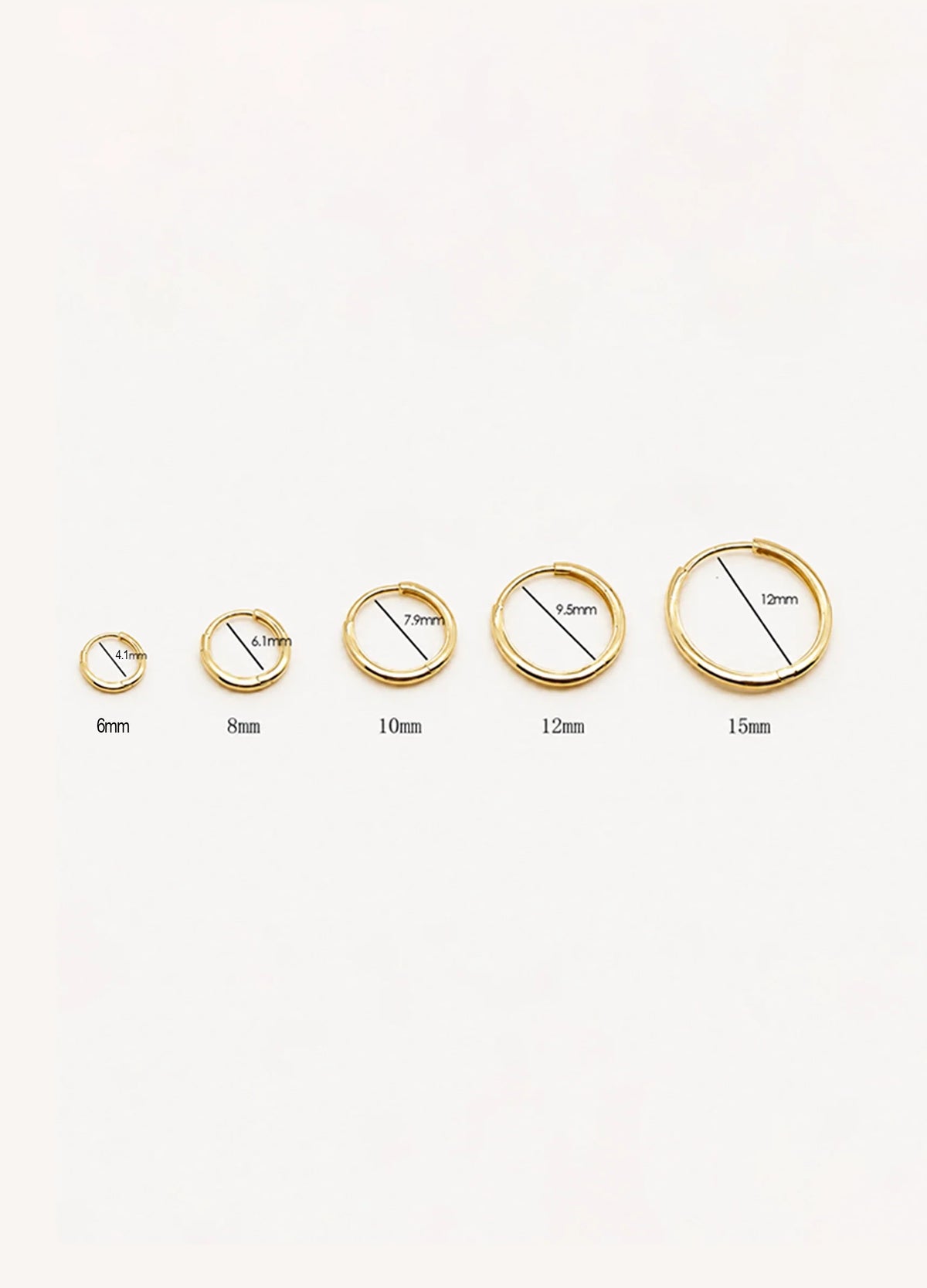 Five solid gold hoop earrings from 6mm to 15mm shown side by side with measurements