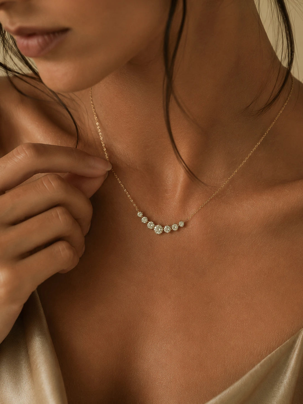 Close-up of a woman wearing a delicate necklace with small diamonds.