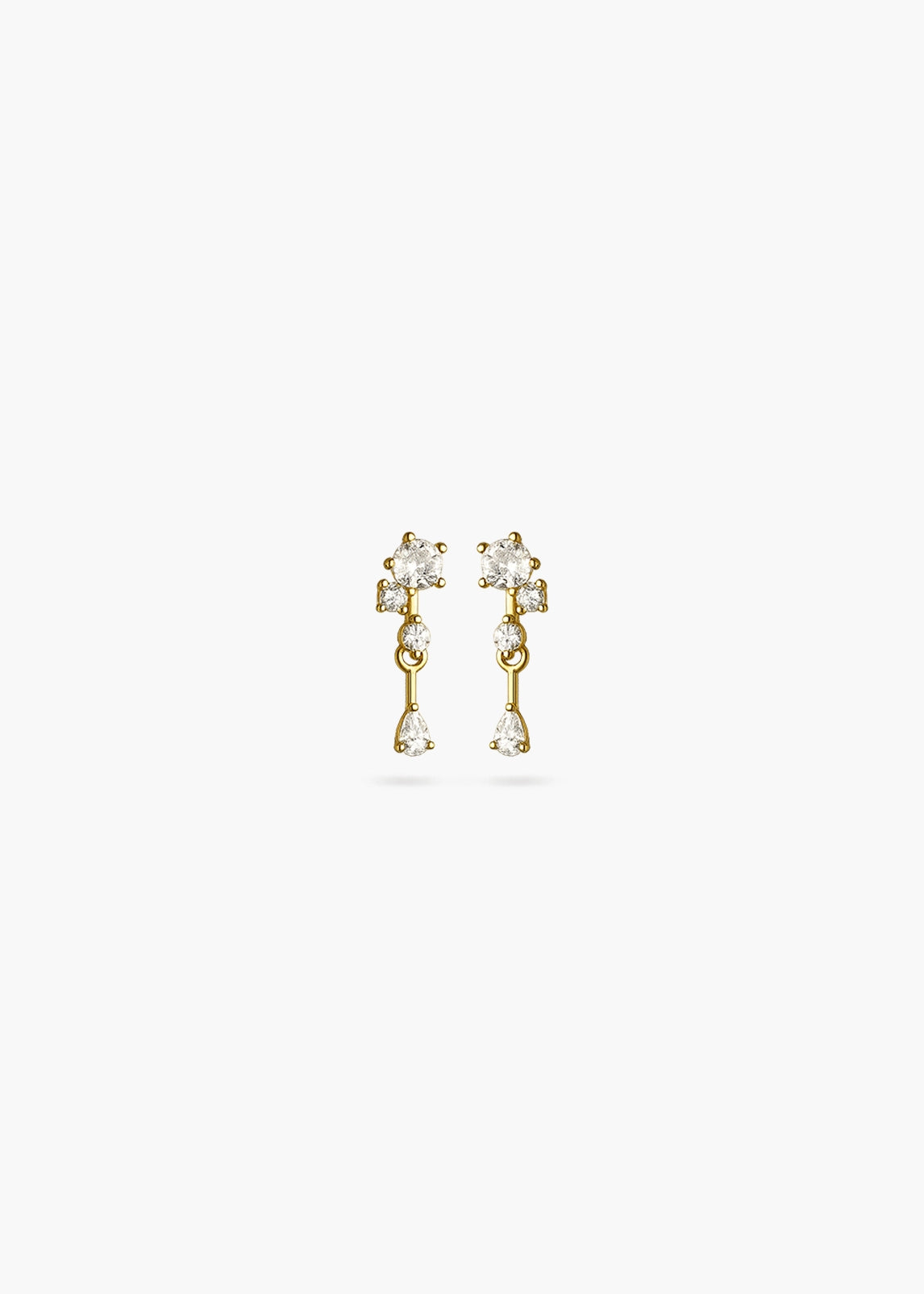 A pair of gold dangle earrings with clear gemstones, shown against a plain white background.