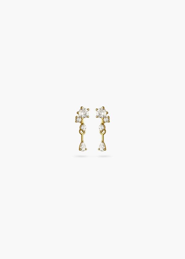 A pair of gold dangle earrings with clear gemstones, shown against a plain white background.