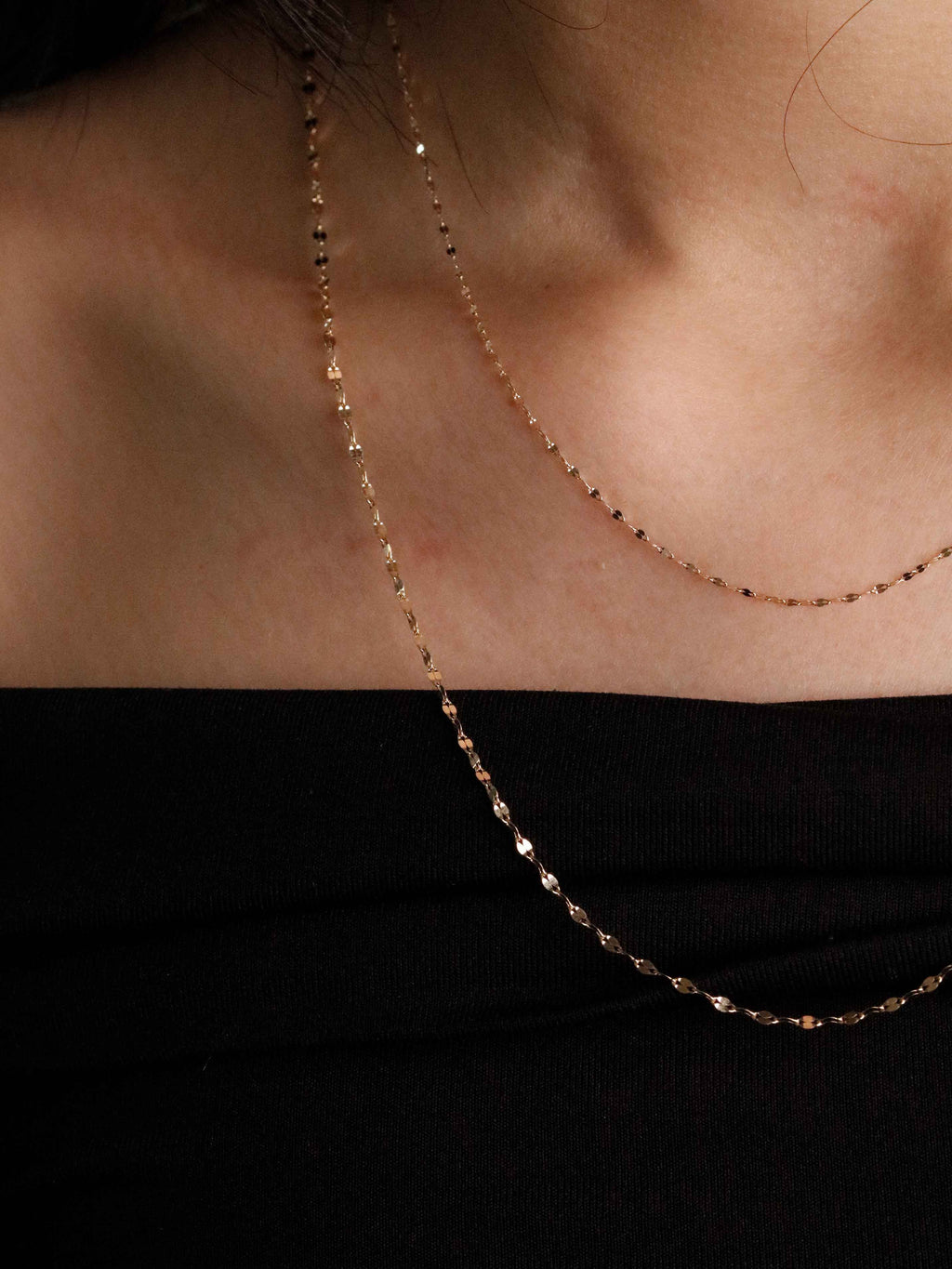 1.72 mm and 1.08 mm gold necklace on neck