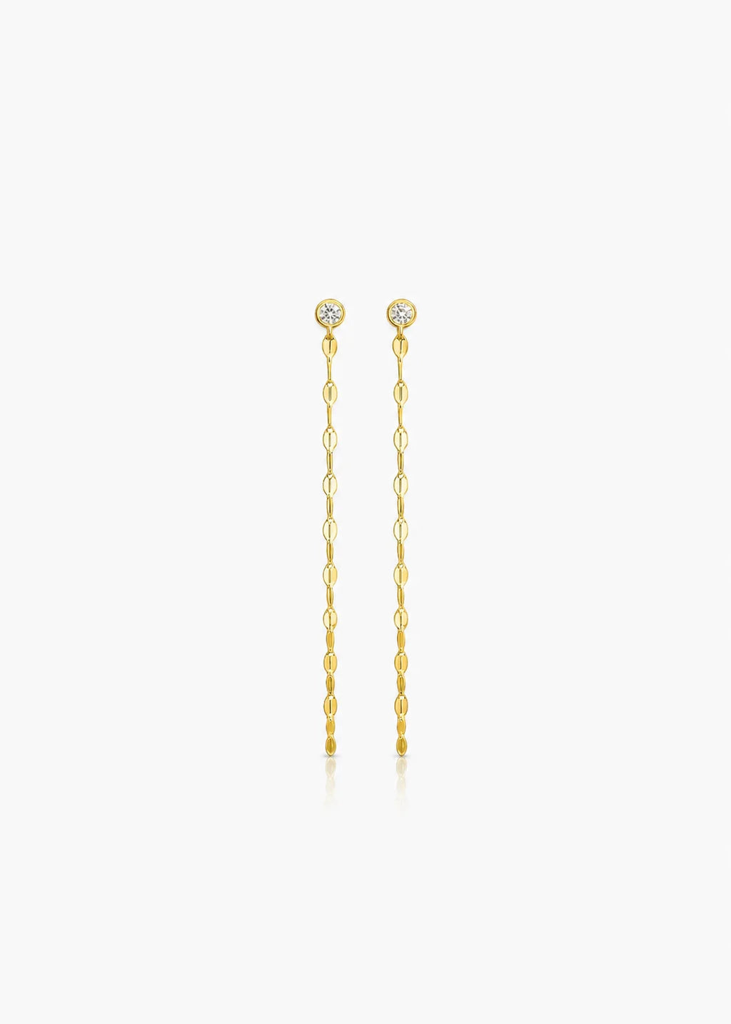 A pair of gold drop earrings with small round clear stones at the top and dangling chain links below, centered on a light gray background.