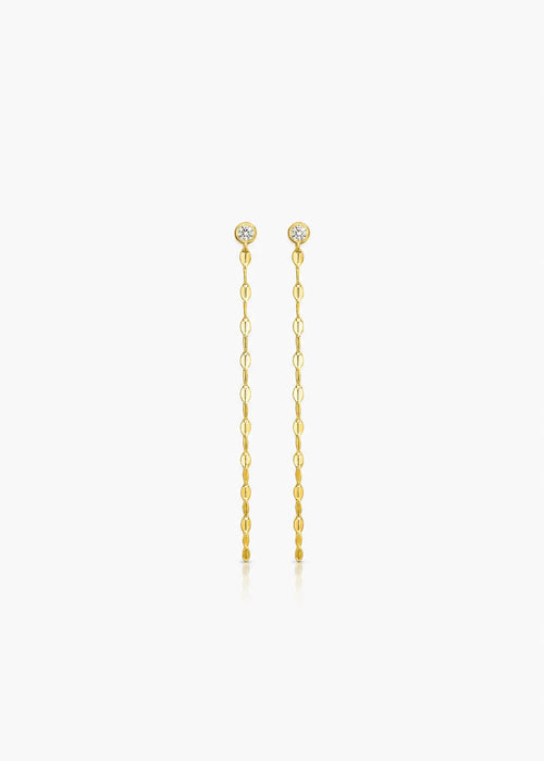 A pair of gold drop earrings with small round clear stones at the top and dangling chain links below, centered on a light gray background.