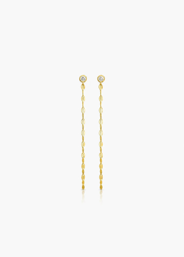 A pair of gold drop earrings with small round clear stones at the top and dangling chain links below, centered on a light gray background.