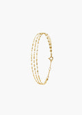 A delicate gold multi-strand chain bracelet with small bead-like links and a lobster clasp, displayed on a clean white background.
