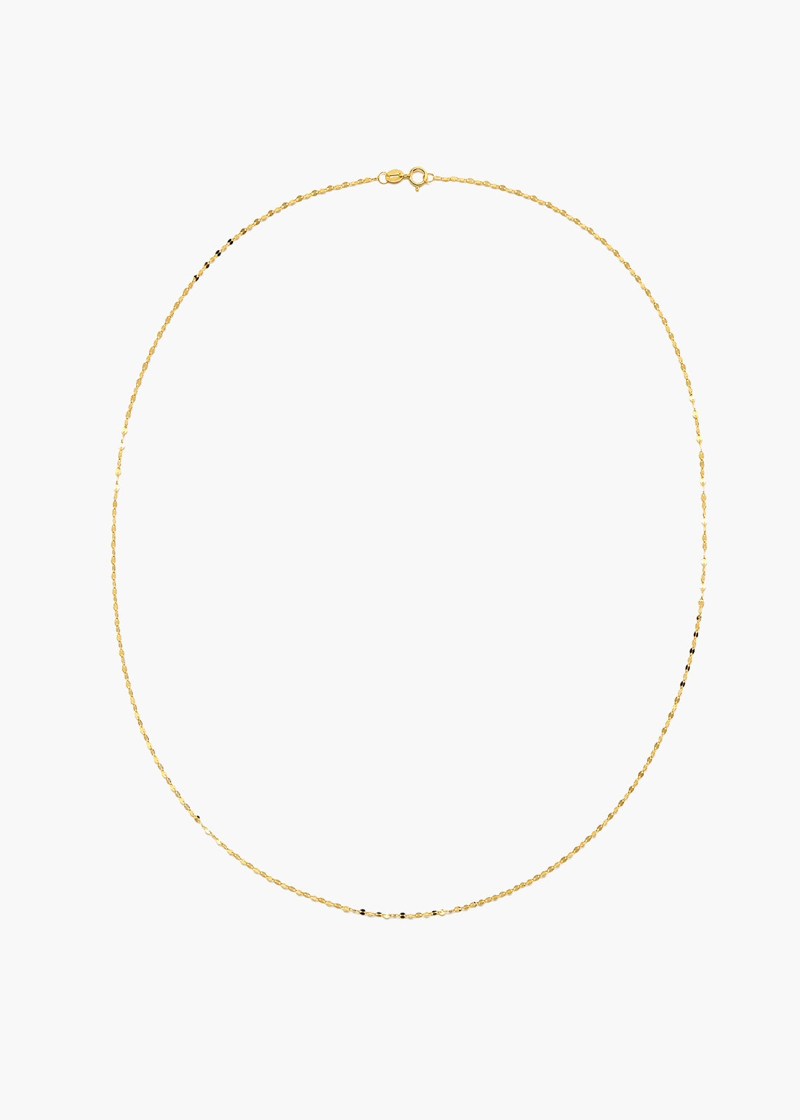 A delicate gold chain necklace with small, evenly spaced black beads, displayed in an oval shape against a solid white background.