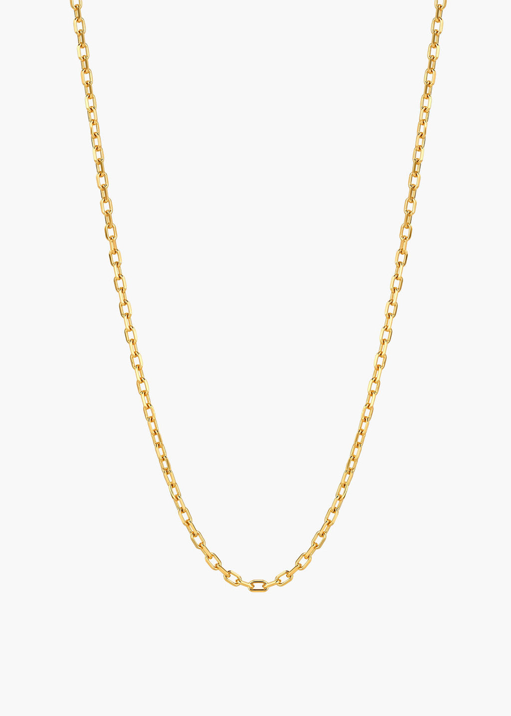 A delicate gold chain necklace with a classic curb link design, displayed against a clean, light off-white background.
