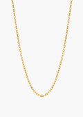 A delicate gold chain necklace with a classic curb link design, displayed against a clean, light off-white background.