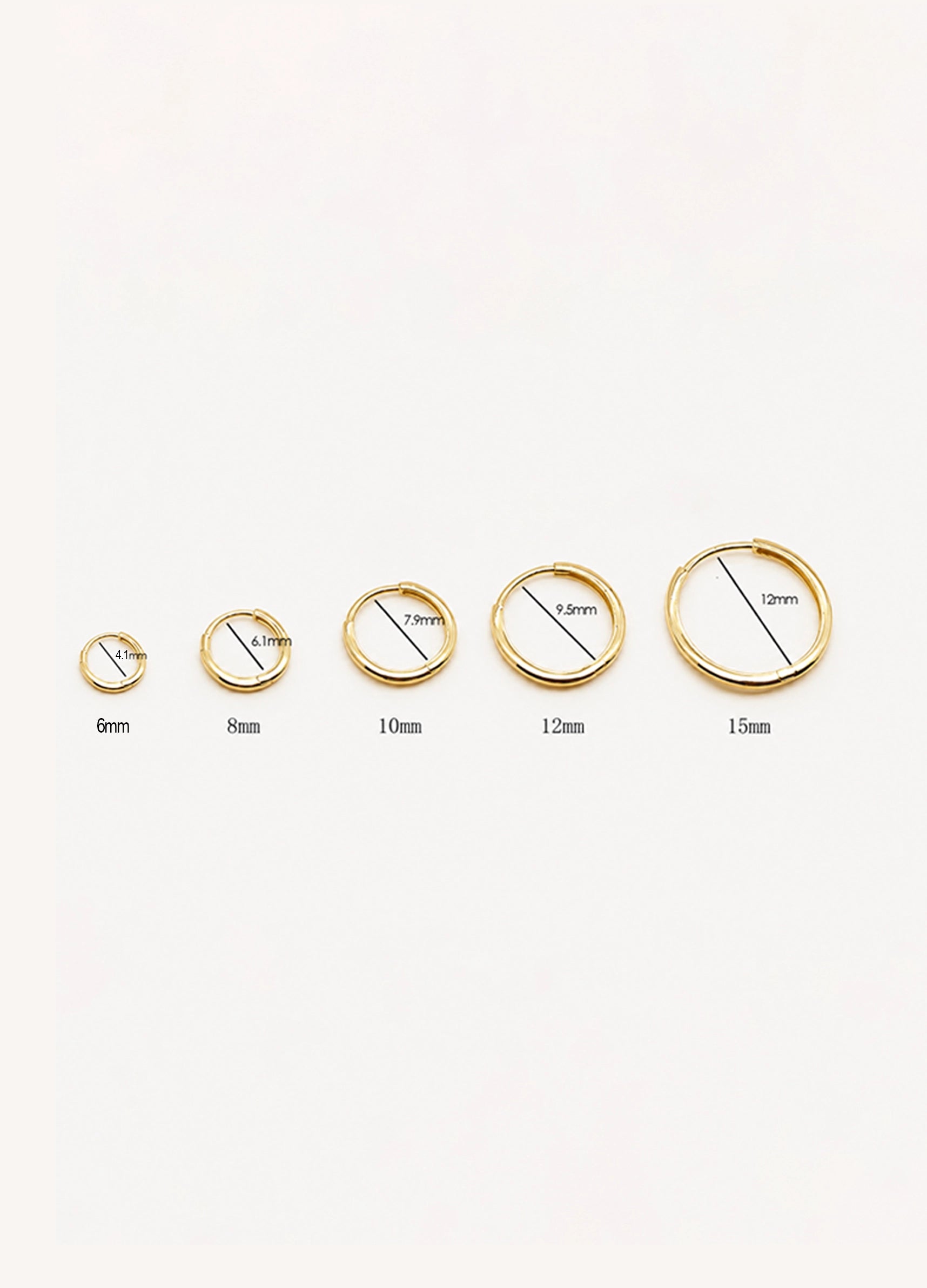 Five gold-toned hoop earrings shown in ascending size from left to right, with black measurement lines and labels indicating 6mm, 8mm, 10mm, 12mm, and 15mm on a plain white background.