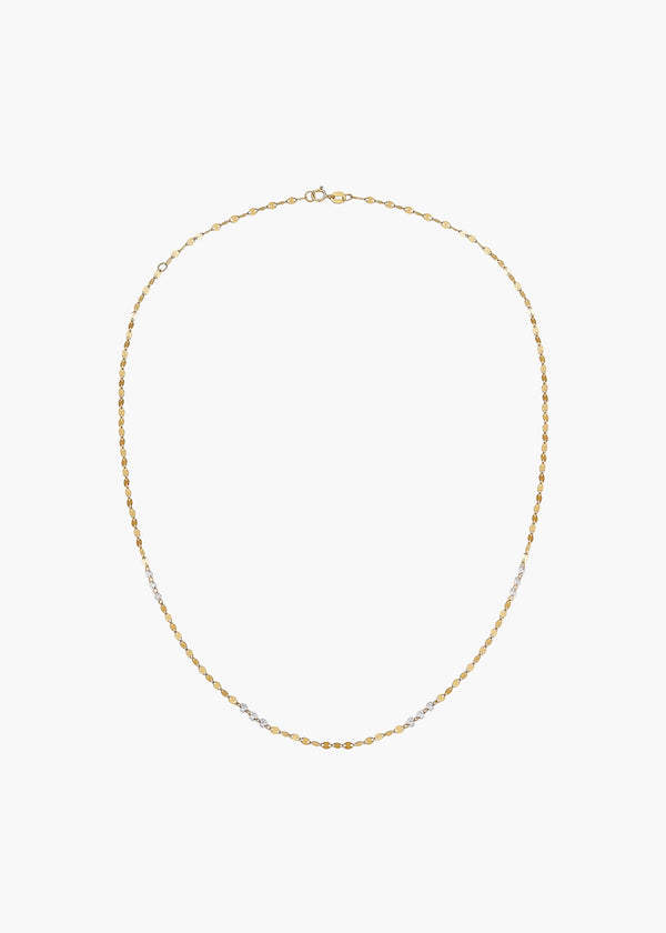 A delicate gold chain necklace with small alternating gold and silver beads, displayed on a clean white background.