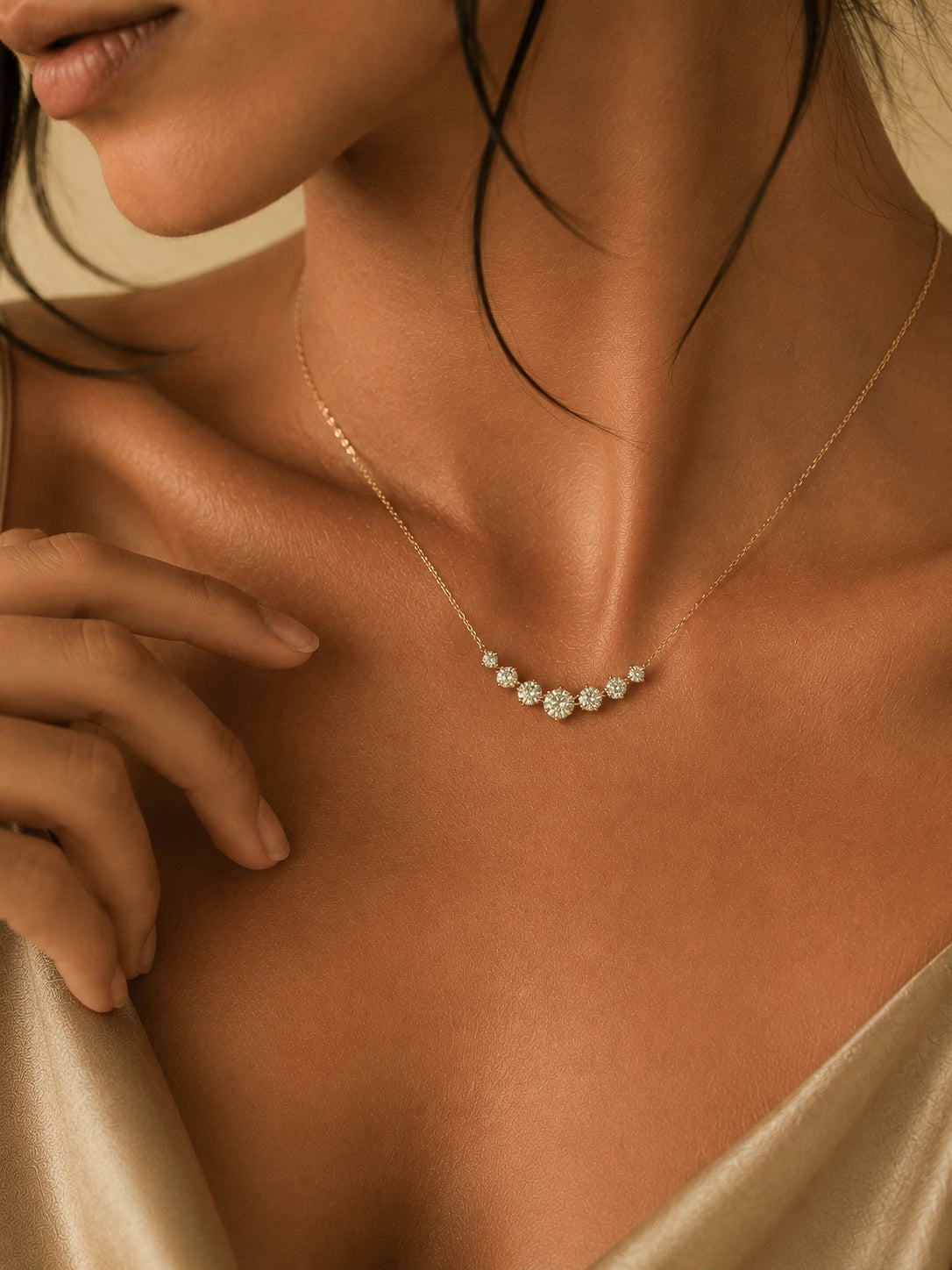 Close-up of a woman wearing a delicate gold necklace with small diamonds.