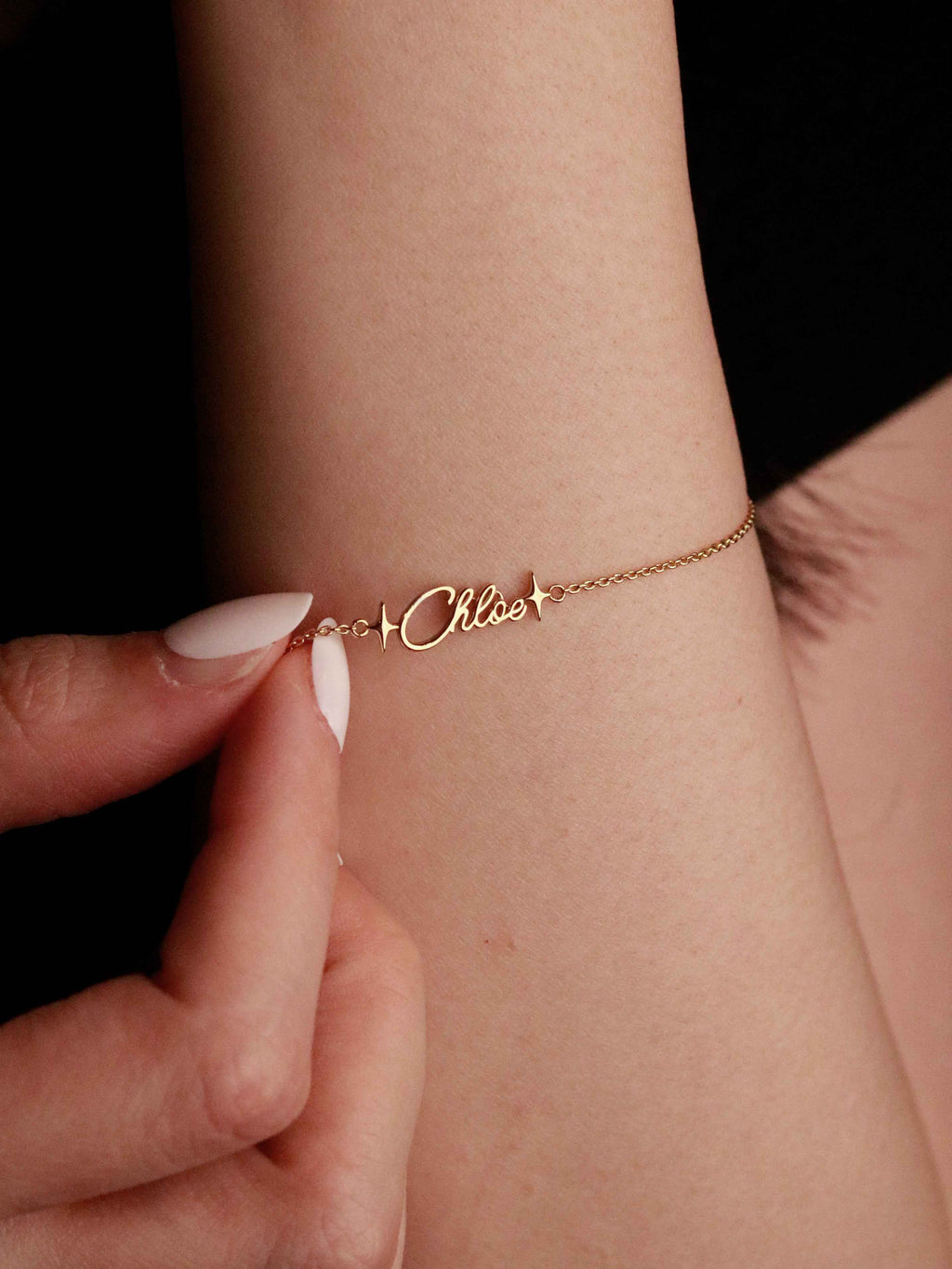 showing a bracelet with name and stars 
