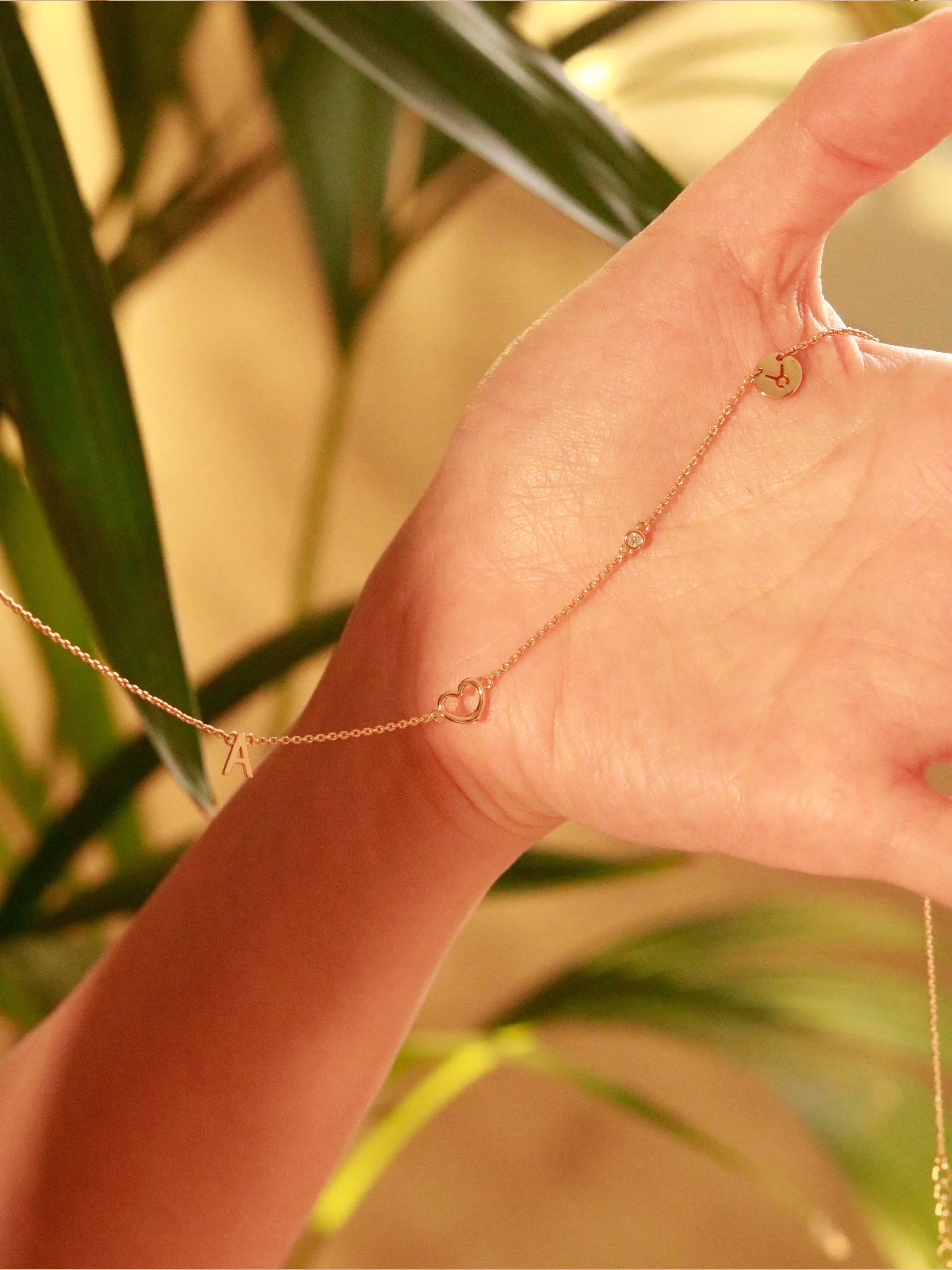 custom initial necklace with zodiac sign, gem,  letter and symbol 
